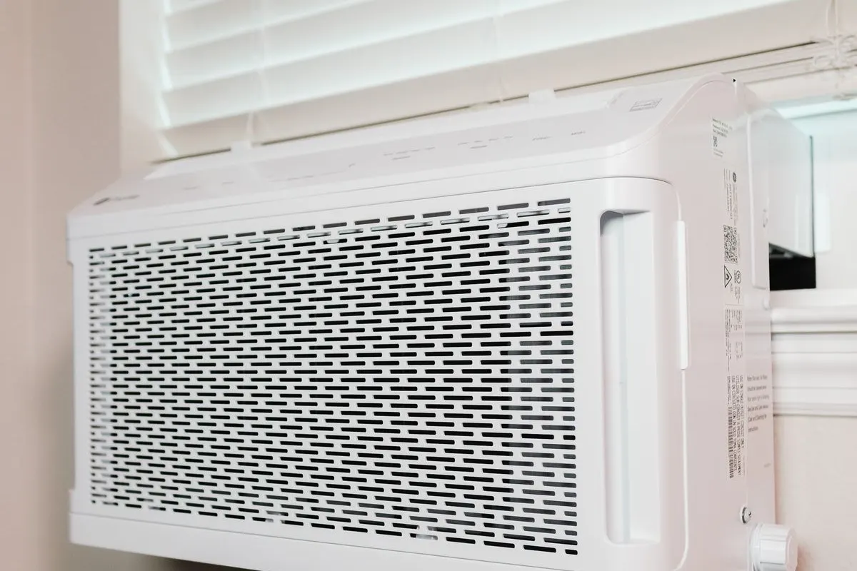 Wall-mounted air conditioner in a bright home interior